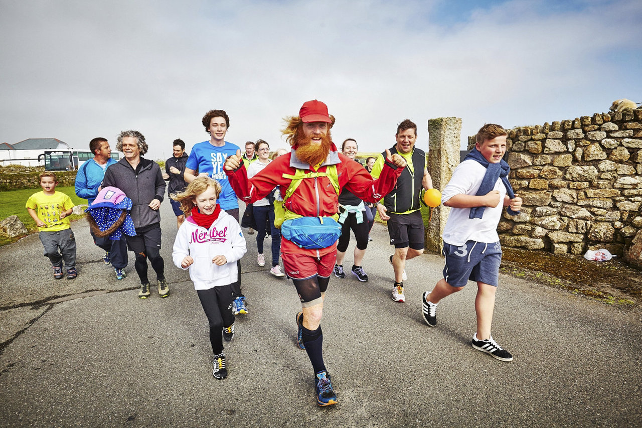 Sean Conway arriving at Land's End after completing The Ultimate British Triathlon. Land's End - 03.05.15. Photo from Red Bull