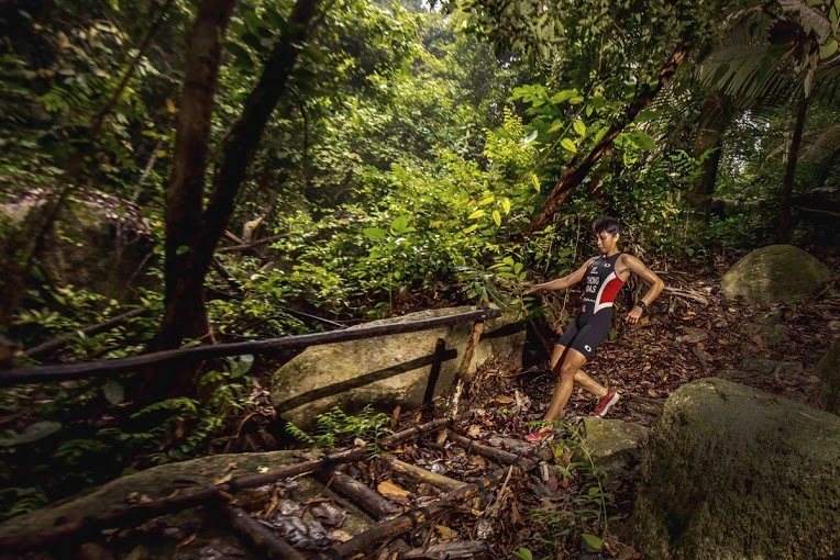 Malaysia's National Triathlete, Irene Chong running the jungle trails.