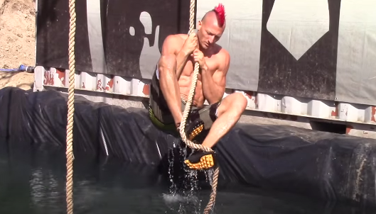 Demonstrating the various hooks for the rope climb. Image from video