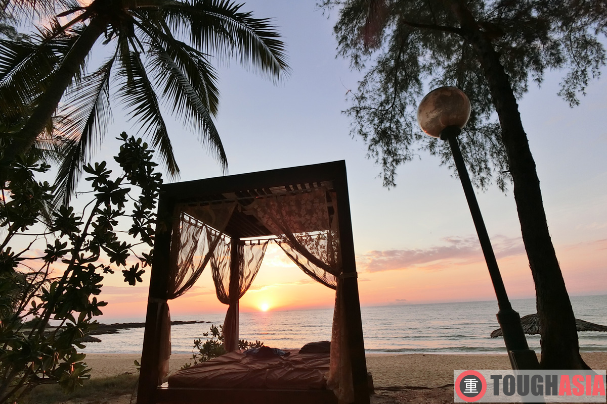 Watch the sunrise from the private pavilion dotting the sandy beach facing the South China Sea. 